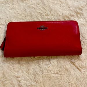 A red COACH wallet